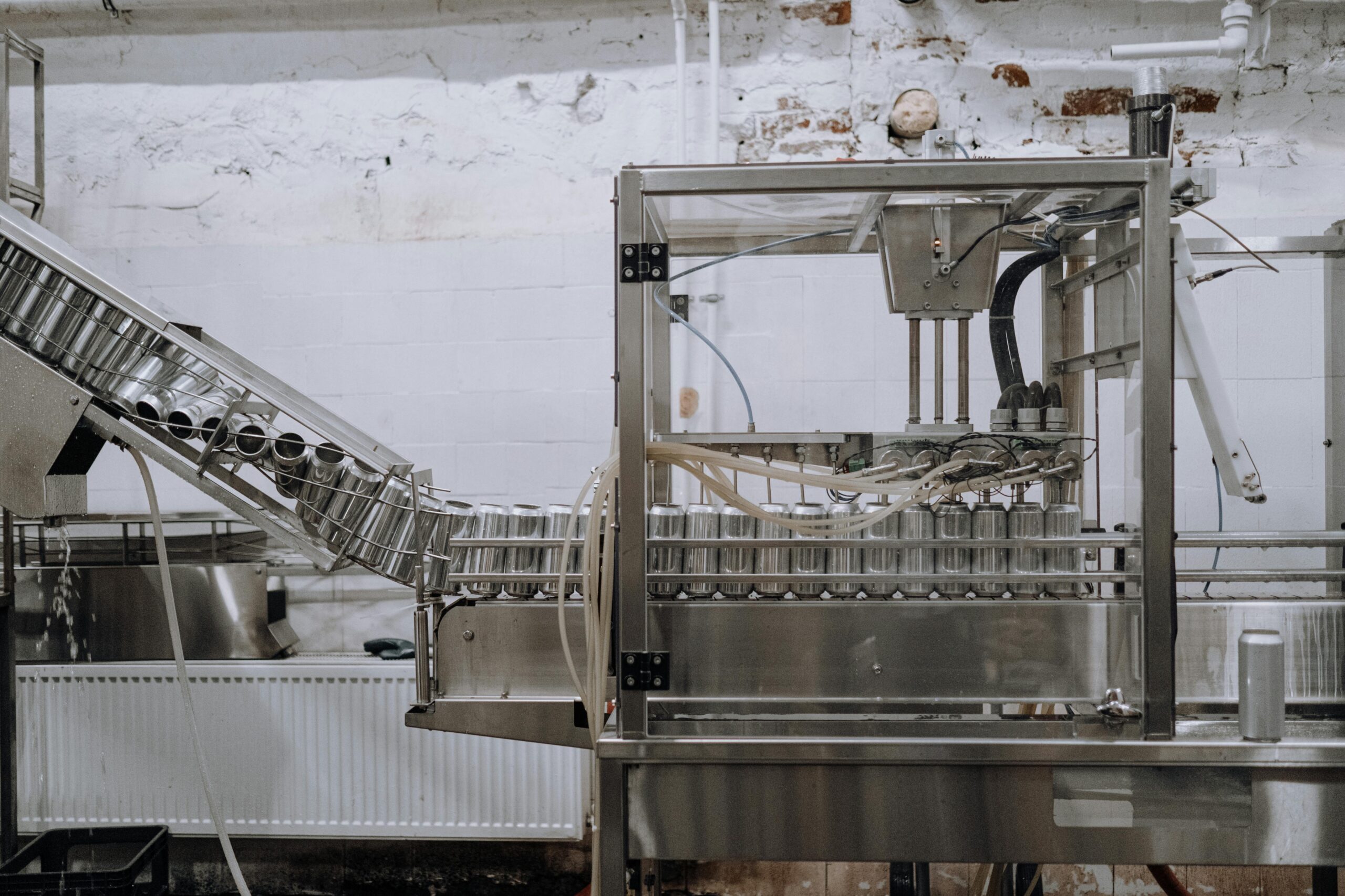 conveyor belt of cans acts a metaphor for the slowdown of housing development applications and approvals.